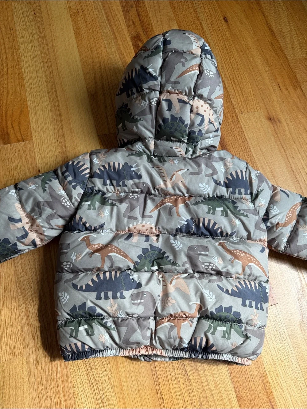 The Children's Place Dino Hooded Puffer Jacket in Tan, Green & Navy
